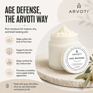 A jar of Arvoti Age Defense Premium  moisturizing balm, set on a textured beige stone with olive branches. The image is a clean promotional graphic with text detailing the benefits of the balm. Benefits such as helps soften the look of fine lines to promote a smoother, more supple looking appearance.
